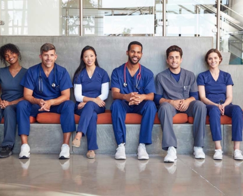 frontline office workers sitting on a bench