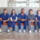 frontline office workers sitting on a bench