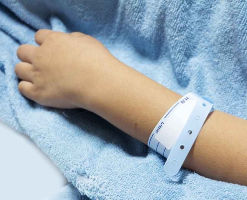 A hospital patient wearing an identification bracelet