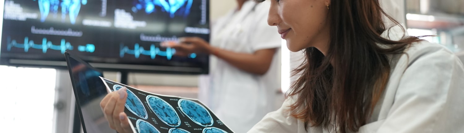 Group of doctors looking at X-ray on medical conference, discussing issues