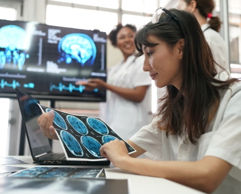 Group of doctors looking at X-ray on medical conference, discussing issues