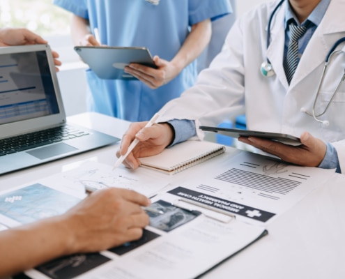 Medical team having a meeting with doctors in white lab coats