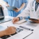 Medical team having a meeting with doctors in white lab coats
