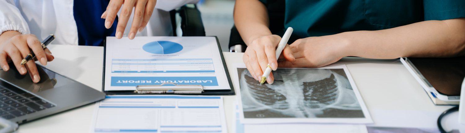 Doctors reviewing cms grievance response requirements paperwork