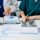 Doctors reviewing cms grievance response requirements paperwork