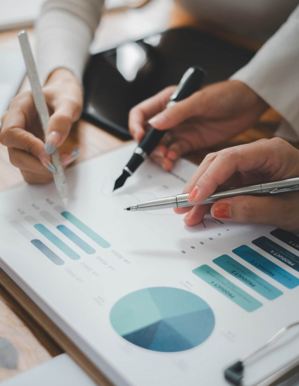 Group of business people analysis summary graph reports of business operating expenses and work data about the company's financial statements.